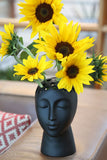 Let your imagination bloom with this unique and stylish head vase!
