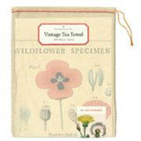 Wildflower Cotton Vintage Tea Towel by Cavallini and Co. Pictured packaged in a keepsake muslin bag