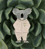 Kevin the Koala Enamel Pin by Jenny Wood Art. Pictured sitting atop a succulent