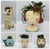 A collection of 5 different Allen Designs planters, including the Baby Brown Hairy Jack planter. The planters are pictured displayed with a variety of succulents and cacti