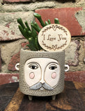 Allen Designs Baby Brown Hairy Jack Planter. Pictured planted with an Ogre Ears succulent and an I love you timber plant tag