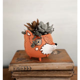 Allen Designs Baby Fox Planter. Pictured planted with a variety of succulents