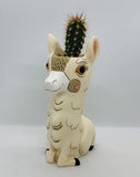 Baby Llama Vase / Planter by Allen Designs. Pictured planted with a cactus