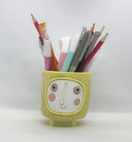 Baby Sun Planter by Allen Designs. Pictured as a pen holder