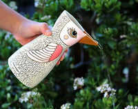 White bird vase or watering can by Allen Designs. Pictured in use as a watering can