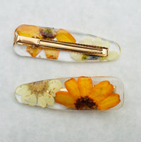 Daisy Hair Clips by Petal and Stem. Picture shows front and back of hair clips